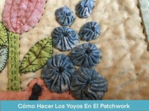 Hacer Yoyos Para El Patchwork - Circulos de tela fruncidos y aplicados sobre un quilt.
